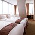 Hotel Skypark Myeongdong II Seoul room with four twin beds and large windows