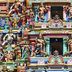 Hotel Maurya International in Chennai with a colorful ornate temple-style facade and sculpted figures