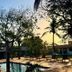Pousada Chale Heloisa in Jijoca de Jericoacoara with pool, lounge chairs and tropical garden at sunset