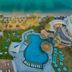 Le Méridien Abu Dhabi Resort in Abu Dhabi with beachfront pool, palm trees, sun loungers and sea view