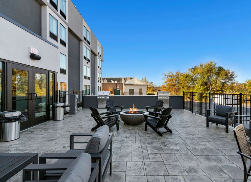 Spark by Hilton Harrisonburg University Area rooftop patio with fire pit and outdoor seating in Harrisonburg
