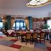 Mercure Reggio Emilia Centro Astoria restaurant with colorful carpet, set tables and large windows