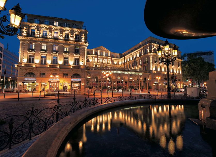 Steigenberger Icon Frankfurter Hof in Frankfurt am Main, lit at night with reflected lights in a courtyard pool