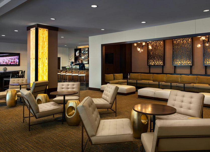The Lincoln Marriott Cornhusker Hotel in Lincoln lobby lounge with tufted chairs, tables and sectional seating