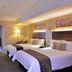 Birchwood Hotel and OR Tambo Conference Centre room in Boksburg with two twin beds and a desk