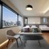 Moxy Seoul Insadong room with city-view windows, three beds, and a lounge chair in Seoul