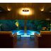 Hakone Ginyu in Hakone indoor lounge opens to a lit pool with forest views