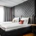 Original Sokos Hotel Arina in Oulu bedroom with a king bed, textured wall, and large sheer curtains