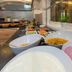 Der Trattner - Hotel Trattnerhof & Hotel Schöcklblick breakfast buffet with yogurt, fruit and cereal bowls