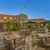 Element Sedona in Sedona outdoor patio with tables, chairs, string lights and red rock views