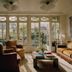 Château Voltaire in Paris living room with tall windows, armchairs and coffee table