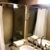 Hosteria La Raclette, San Martín de los Andes bathroom with shower curtain, sink and mirror