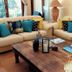 Riversong Guest House Cape Town lounge with cream sofas, wooden coffee table, and patio view