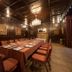Bartley Lodge Hotel Southampton private dining room with long set table, chandeliers and dark wood paneling
