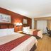 Red Roof Inn & Suites Stafford, VA - Quantico guest room with two beds, desk, and TV