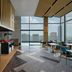 Hilton Garden Inn Bangkok Riverside dining area with floor-to-ceiling windows and city views