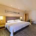 City Comfort Inn Foshan Zumiao Zhangcha guest room with king bed, desk, chair, and wall-mounted TV in Foshan