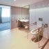 Premier Inn Karlsruhe City Am Wasserturm bathroom with accessible sink, toilet, grab bars and walk-in shower