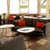 ibis Nogent-sur-Marne lounge with sofas, red chairs and large windows