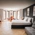 Hôtel Lac Carling Golf & Spa in Grenville suite with sofa, bed, dining table and large windows