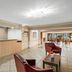 Red Roof Inn Etowah - Athens, TN lobby with front desk, tiled floor, and seating area in Etowah