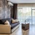 Prestige Deluxe Hotel Aquapark Club in Golden Sands, guest room with sofa, armchair and balcony view