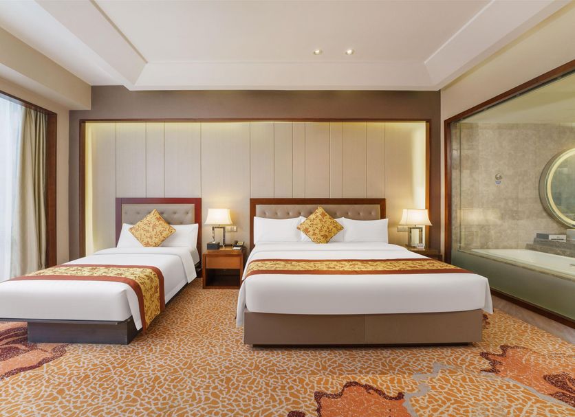 The Longemont Shenyang guest room with two beds and floor-to-ceiling window in Shenyang