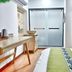 Tonight Inn Hangzhou room with desk, frosted glass door and wood wardrobe