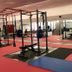 Hotel Parco Delle Rose gym in San Giovanni Rotondo with weightlifting equipment and mirrored walls