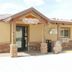 Bryce Uptop Lodge motel office exterior with Wilson's Peak sign and stone-and-wood entrance in Bryce