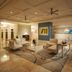 DoubleTree by Hilton Hotel Sunrise - Sawgrass Mills lobby with seating area and abstract wall art