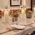 Holmes Hotel London in London dining table set with candles, glassware and place settings