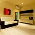 Residence Diamanterosso in Terni living area with sofa, floor lamp, wall art and TV