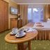 Hotel Polaris III in Świnoujście guest room with double bed, balcony doors, and tea tray