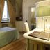 Hotel Parco Borromeo room in Cesano Maderno with twin bed, desk, and curtained window