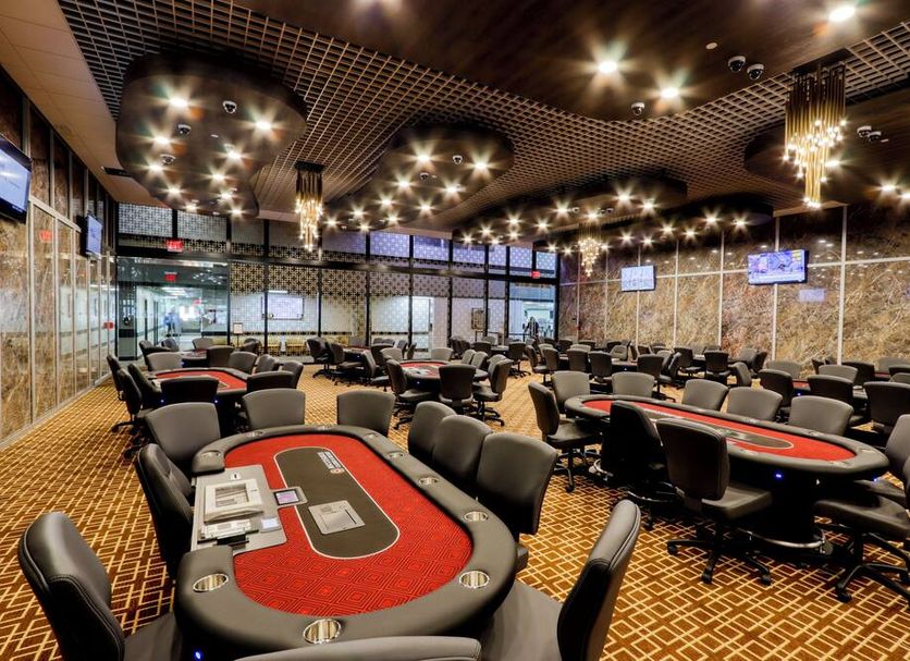 Miccosukee Casino & Resort in Tamiami casino floor with poker tables and chairs