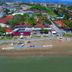 Clover Magic Altinkum Park Hotel in Side, aerial view of beachfront and nearby red-roofed buildings