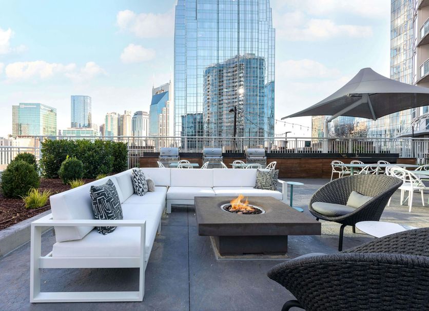 Placemakr Premier Sobro rooftop lounge with fire pit and city skyline in Nashville