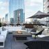 Placemakr Premier Sobro rooftop lounge with fire pit and city skyline in Nashville