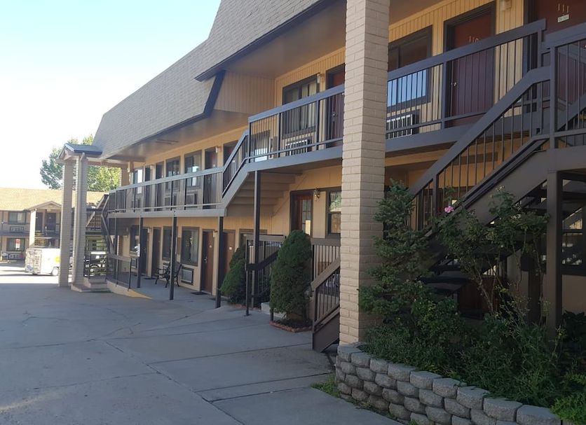 The Kc Motel Show Low exterior with two-story exterior corridors and stairways in Show Low