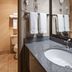 Best Western Lakewood, Tacoma: bathroom with granite vanity, sink, mirror and tub-shower area