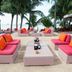Centara Koh Chang Tropicana Resort in Ko Chang with beachfront lounge seating, palm trees, and sea view