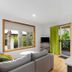 Blue Lake Holiday Park Mount Gambier living area with windows, balcony door, and greenery outside