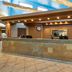 Best Western East Zion Thunderbird Lodge lobby front desk in Mount Carmel with rustic wood beams and stone counter
