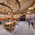 Grandeur Hotel Dubai lobby lounge with colorful seating and curved ceiling lights