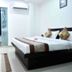 OYO 3815 Hotel Jaisingh Palace room in Indore with double bed, air conditioner and bathroom door