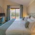 Hotel Santa Gilla room in Capoterra with balcony view, twin bed, desk and chair