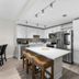 Laketown Wharf 1712 in Panama City Beach kitchen with island, bar stools, stainless steel appliances