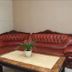 Chengdu Tianfu Lidu Hotel in Chengdu lobby with red leather sectional sofa and coffee table