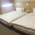 Royal Hotel Taipei City room with two twin beds and a bedside lamp